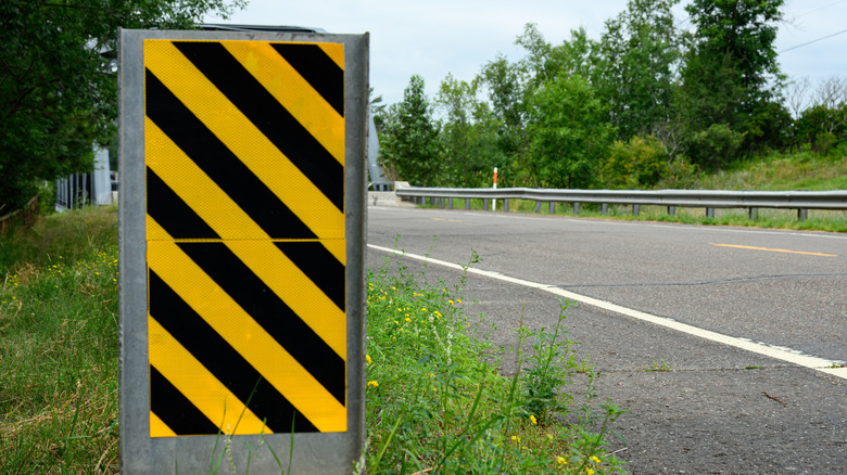 Here's What Those Diagonal Black And Yellow Striped Road Signs Are Telling You