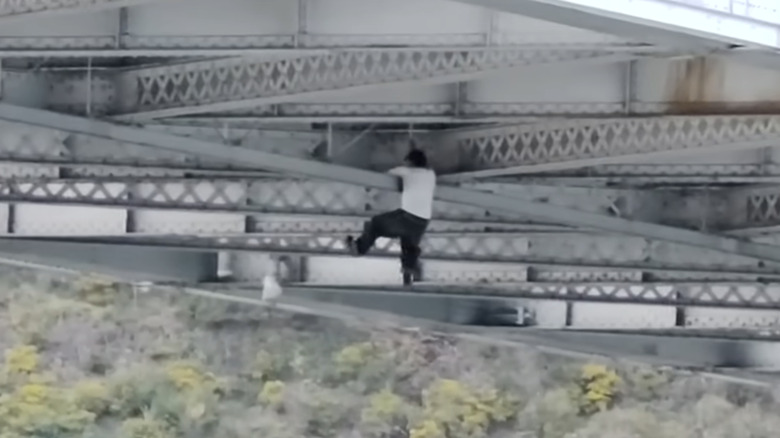 Suspected Car Thief Spider-Mans Through Underside Of Bridge Trying To Escape Police