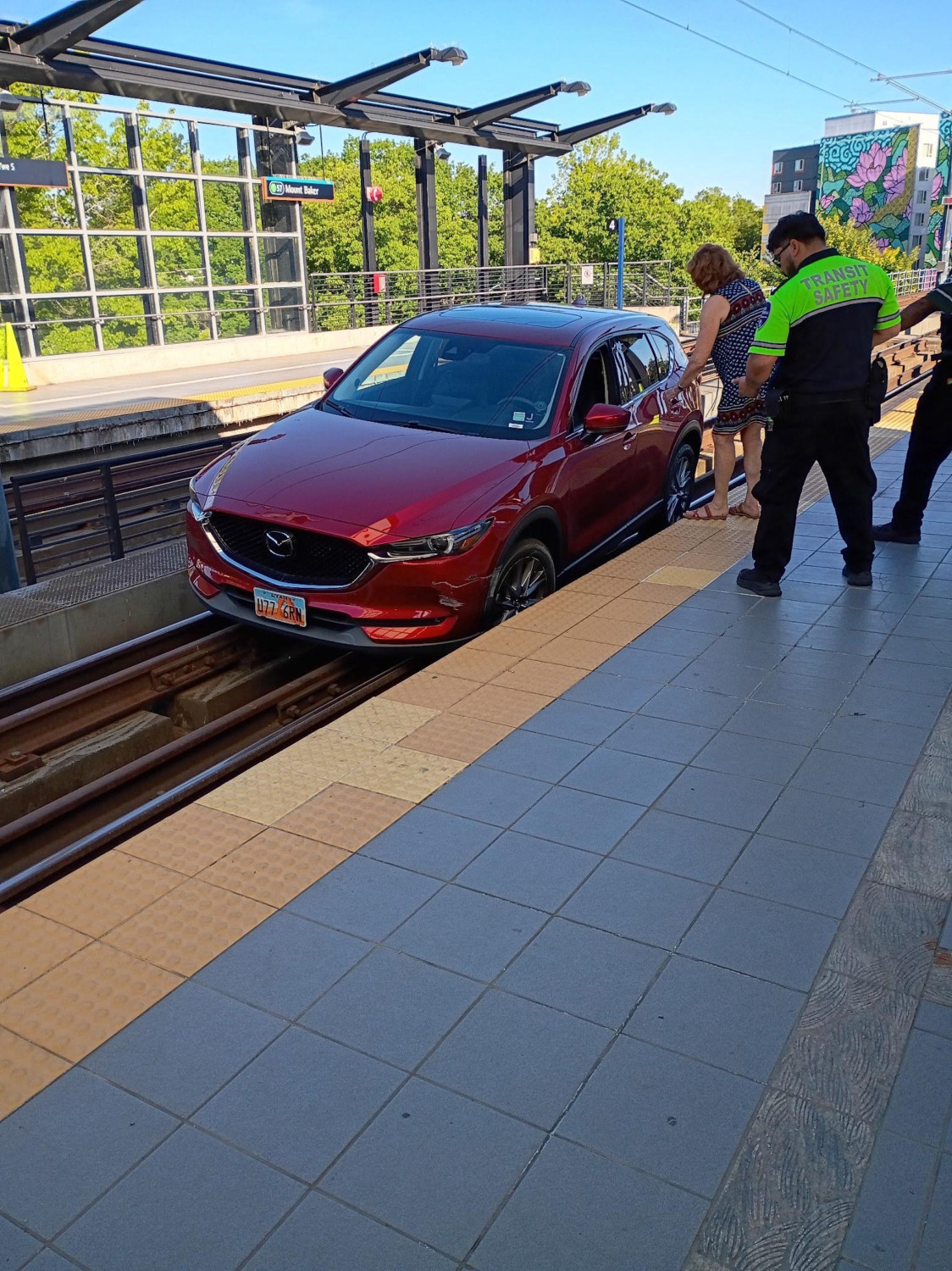 Mazda, Seattle Mazda Driver Cruises Into Elevated Light Rail Station on the Train Tracks