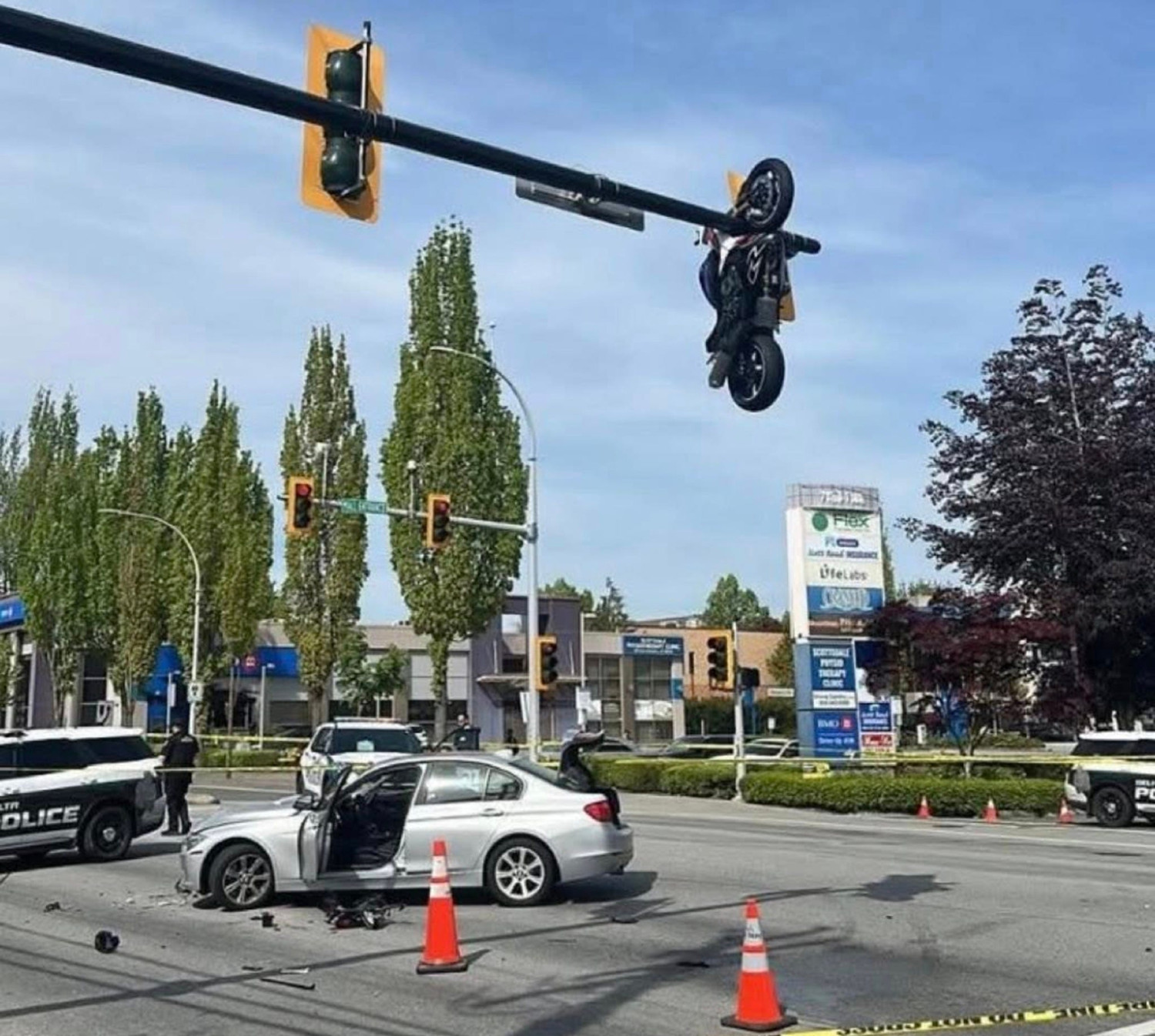 Motorcycle Left Hanging from Traffic Light After Dramatic BMW 3-Series Crash