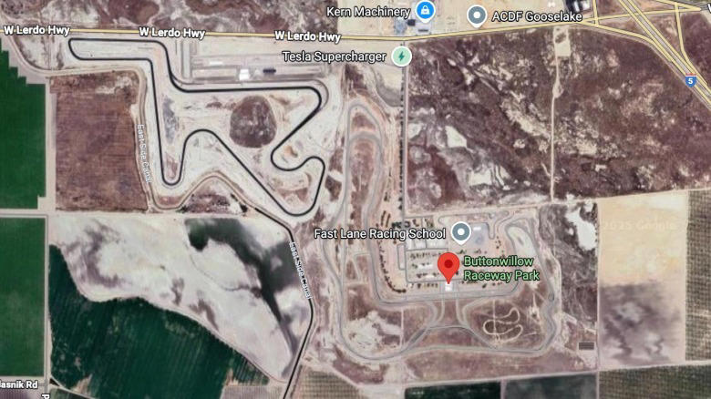 Tesla driver gets lost, drives onto track during motorcycle race