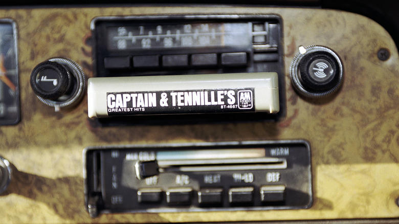 When did automakers switch from 8-track players to cassette decks?