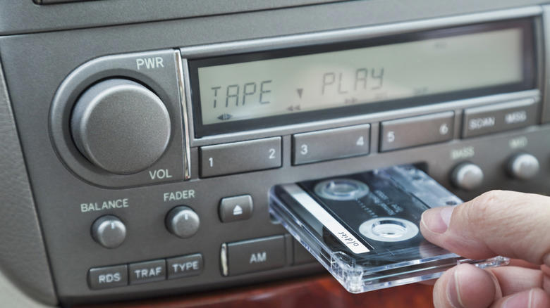 When did automakers switch from 8-track players to cassette decks?
