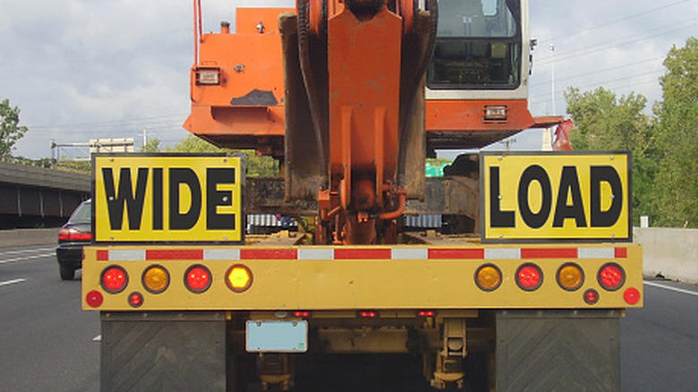 Why cutting off a wide-load semi truck and its lead car is a bad idea