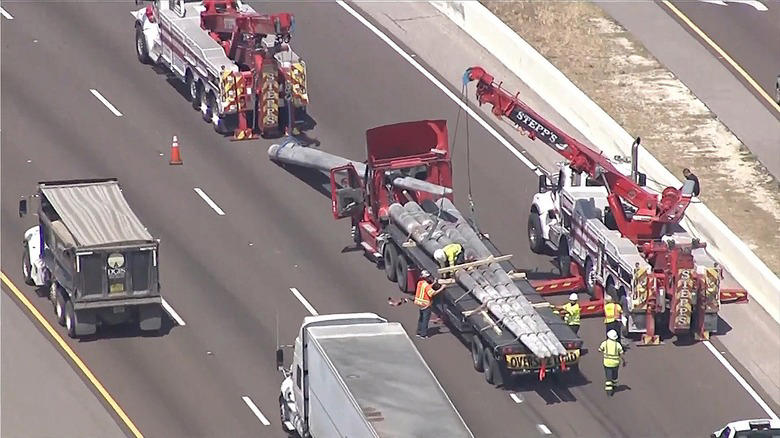 Why cutting off a wide-load semi truck and its lead car is a bad idea