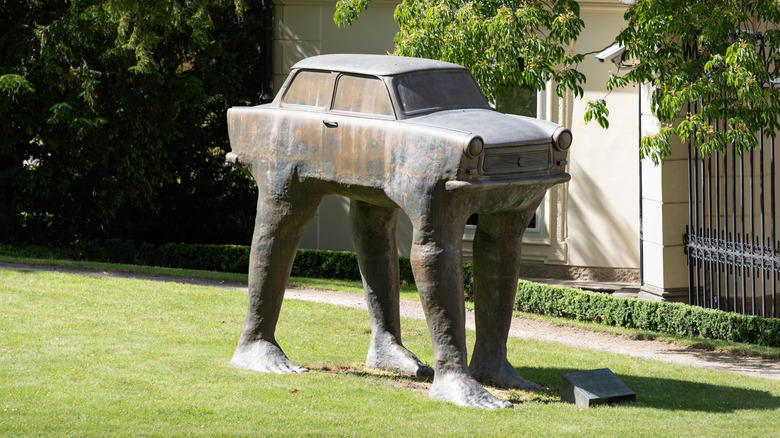 This statue of a Trabant with legs will absolutely haunt your dreams