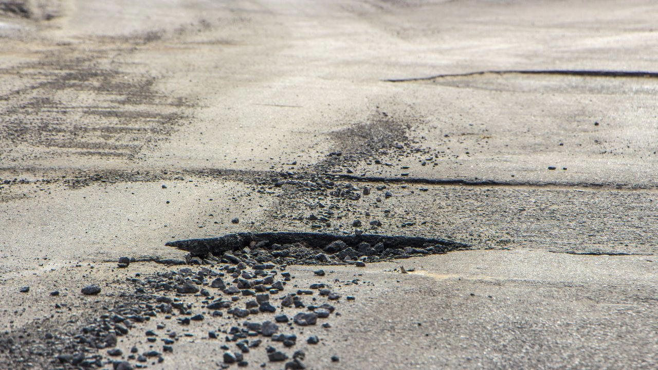 Driver says a pothole cracked his wheel and the city says the road was already repaired
