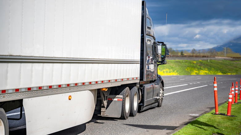 Why do some semi-truck trailers have side skirts?