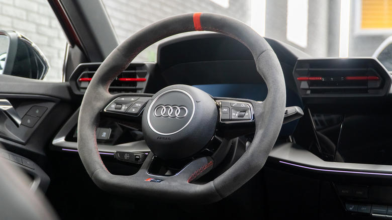 Why do some steering wheels have a flat bottom?