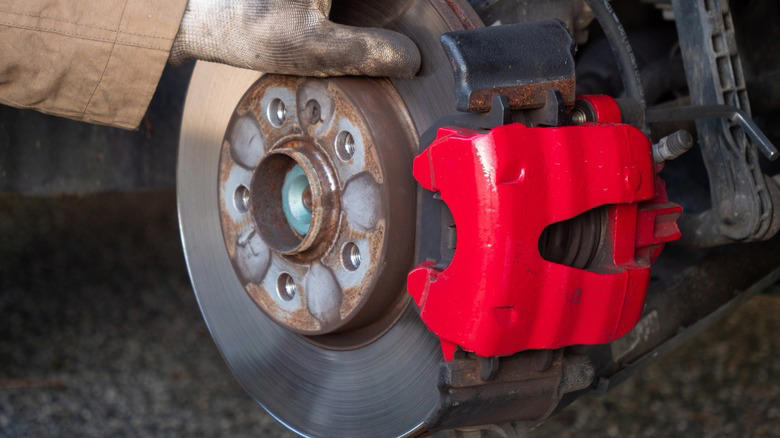 What does a brake caliper piston do and how many does the average car need?