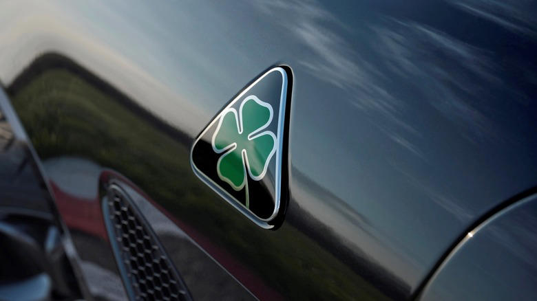 What does the four-leaf clover badge mean on Alfa Romeo vehicles?