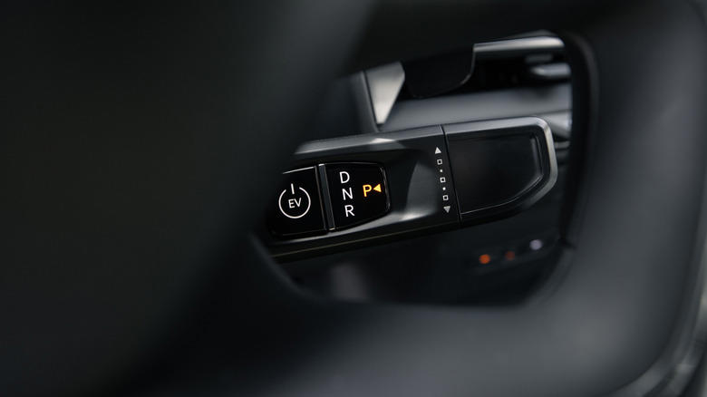 Why did most car manufacturers stop using column-mounted gear shifters?