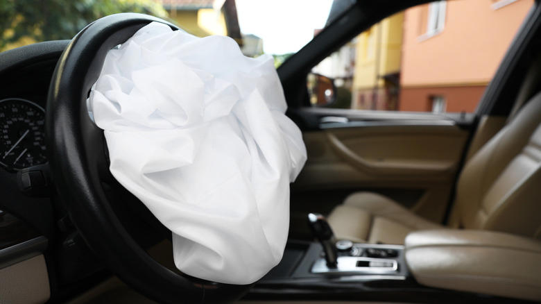 Why did car manufacturers stop using automatic seat belts?