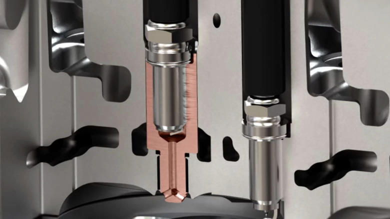 What is turbulent jet ignition and how is it different from an everyday spark plug?