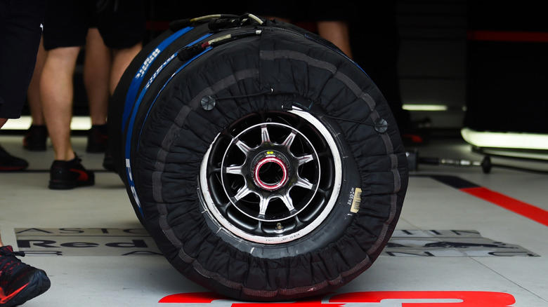 What are the covers on F1 tires for?