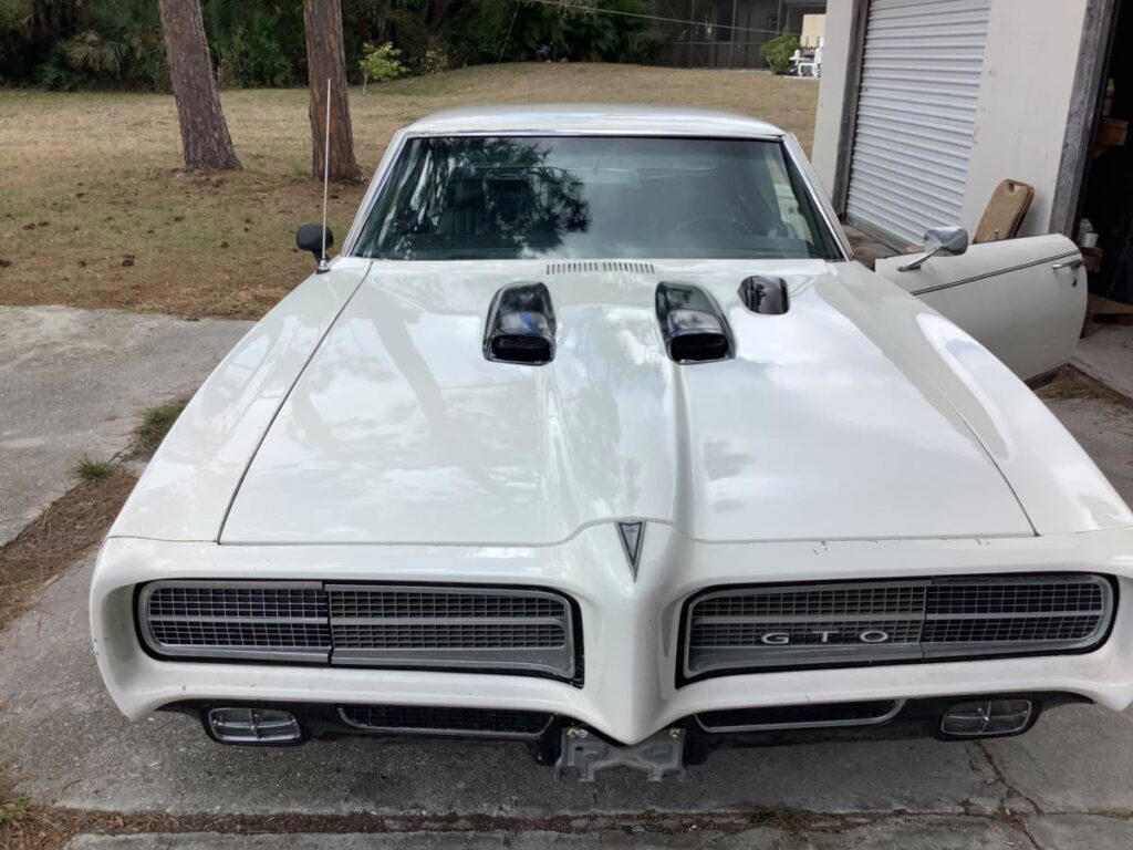 Two 1969 Pontiac GTOs hit the market — one forgotten relic, one 500-HP monster, both facing a deadline