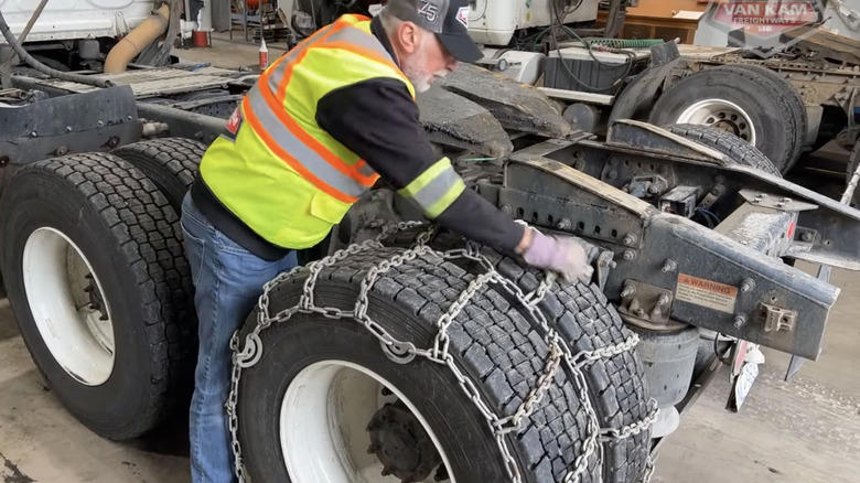 Why do most truckers choose snow chains over winter tires?
