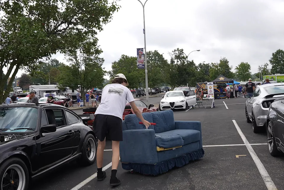 YouTuber Brings a Drivable Couch to a Car Meet, Instantly Enrages Porsche Owner