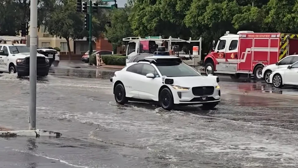 Waymo Struggles With Flooded Phoenix Street as Drivers Wait Behind It