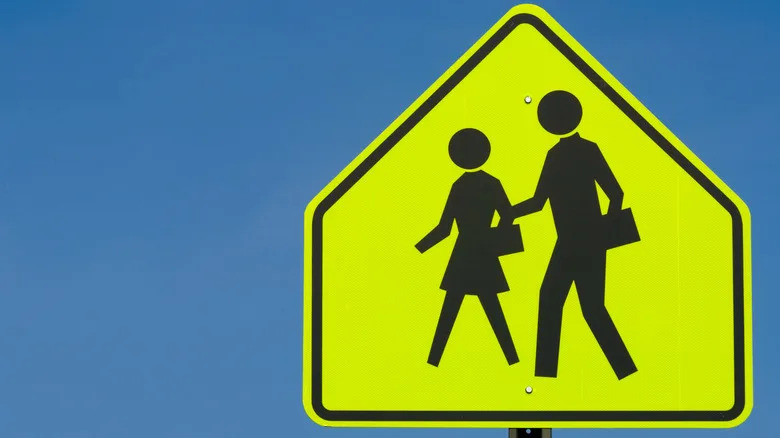 Why School Zone Signs Use That Specific Loud, Glowing, Fluorescent Yellow-Green Hue