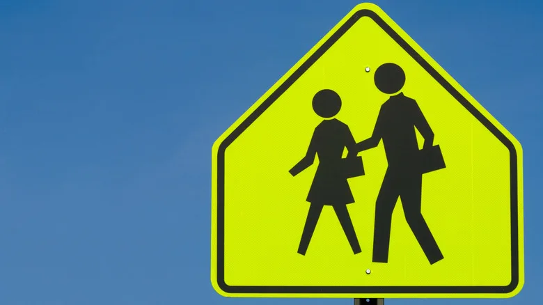 Why School Zone Signs Use That Specific Loud, Glowing, Fluorescent Yellow-Green Hue