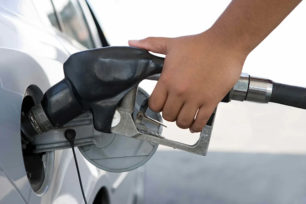 Why You Should Never Keep Pumping Gas After The Nozzle Clicks