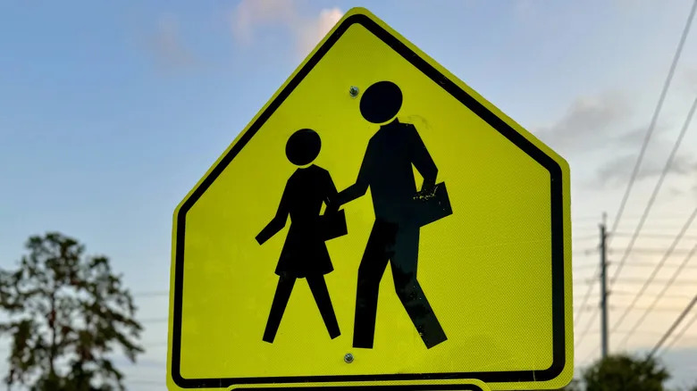 Why School Zone Signs Use That Specific Loud, Glowing, Fluorescent Yellow-Green Hue