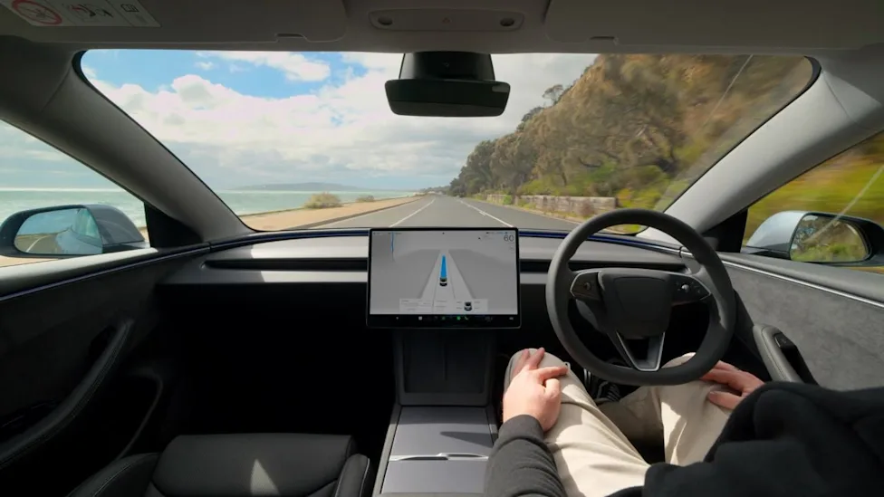 Tesla, Tesla’s Latest FSD Update Feels Smarter — But Critics Say It May Be Too Relaxed