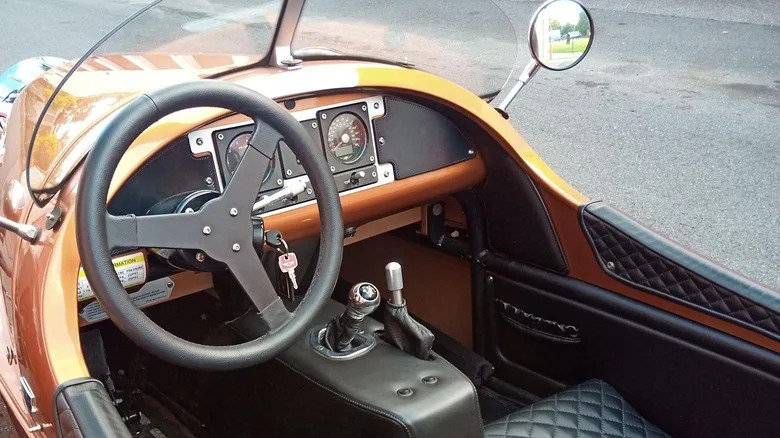You Don't Need Anyone In Your Life Who Says You Don't Need This Orange Morgan 3-Wheeler