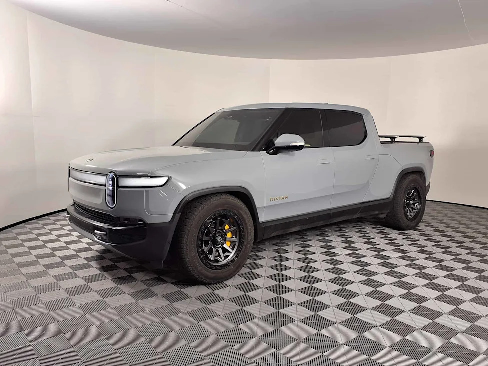 Tesla, Rivian, Tesla Batters Rivian in Self-Driving Test