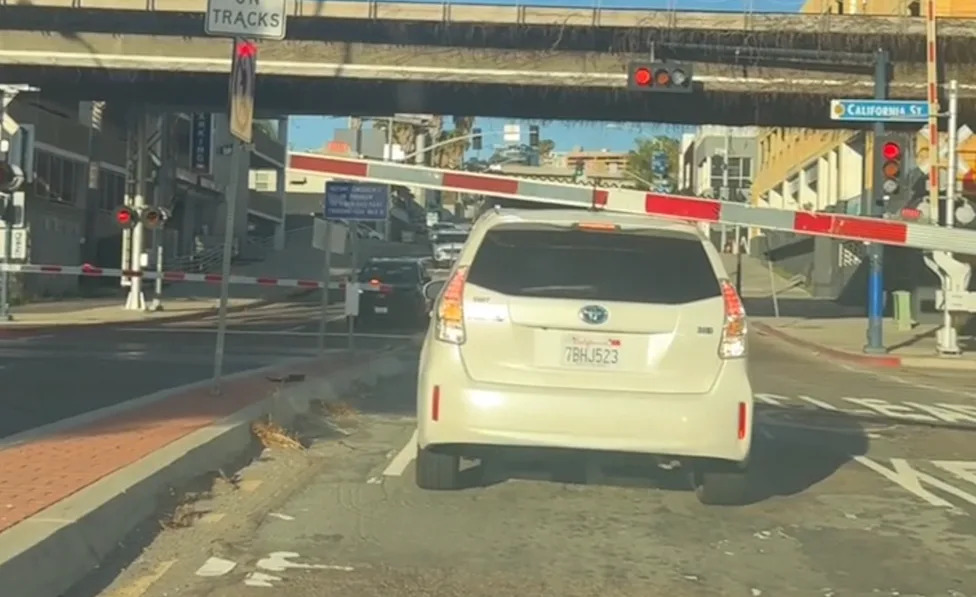 Driver Inches Toward Oncoming Train at Railroad Crossing in Viral Video That Has Everyone Screaming at Their Screens