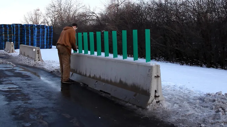 What Are The Green Things On Highway Dividers For?