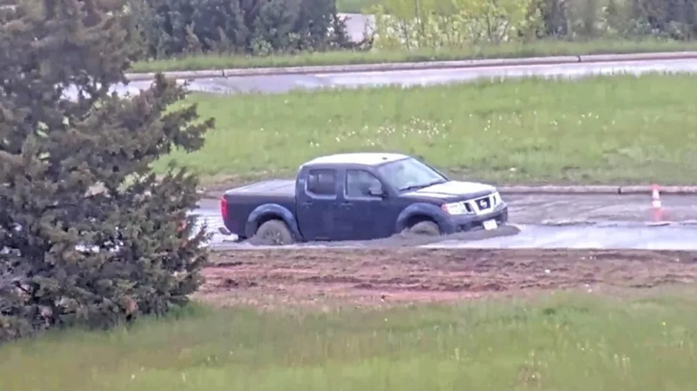Pickup Truck Driver Moves 'Road Closed' Sign, Immediately Gets Stuck In Wet Concrete