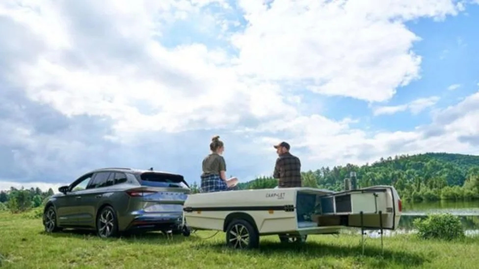 This Tiny Travel Trailer Is Hiding An Entire 10-Person Home On The Go