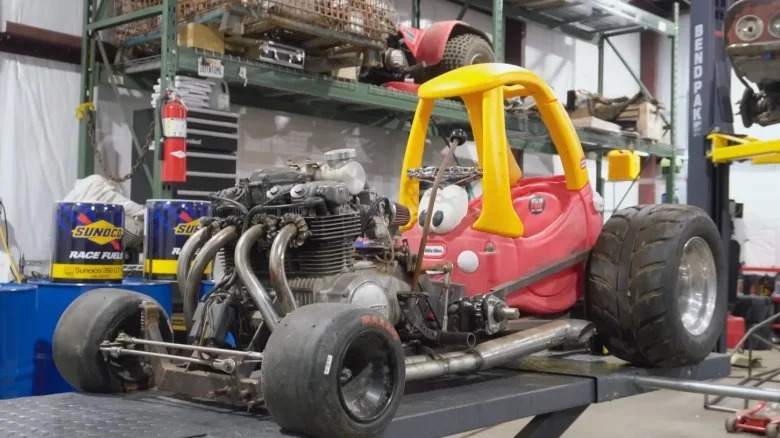 Man Sticks Power Washer Engine In Barbie Power Wheels Car To Keep Gas Budget In Check