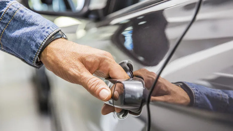 Why You Should Avoid Slamming Your Car Door (And The Damage It Can Do)