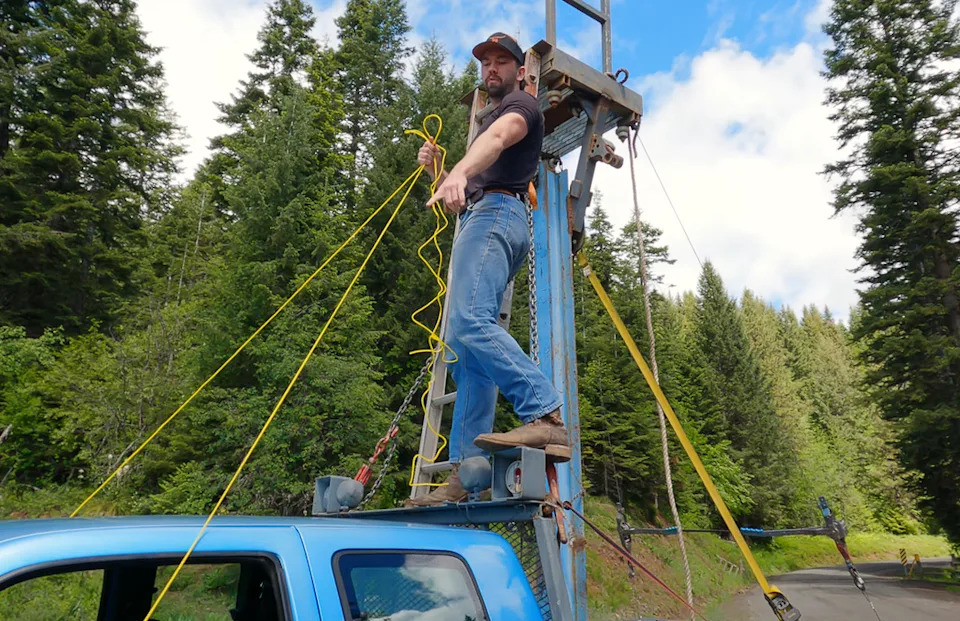 Man Builds a 19-Foot Tower on His Truck and Tries To Drive It With Ropes