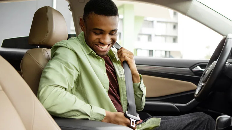 What Is That Little Button On Your Car's Seat Belts For?