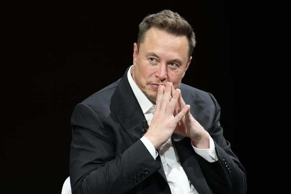 Xiaomi, Tesla, Elon Musk, Xiaomi Launches Robotic EV Charging Arm That Automatically Plugs In Parked Cars, Reviving A Tesla Idea Elon Musk Never Delivered