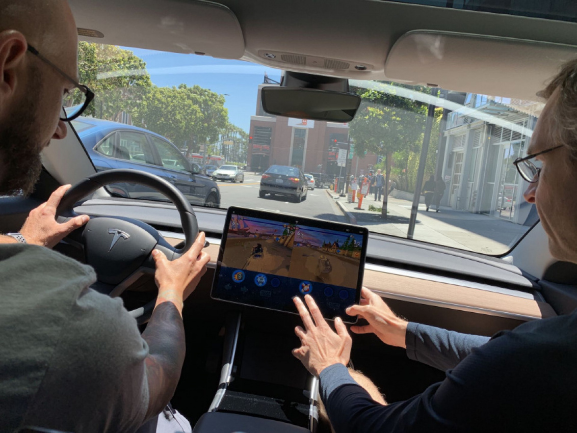 autos, cars, news, space, spacex, tesla, tesla submits partial response to nhtsa’s probe on in-car “passenger play” feature