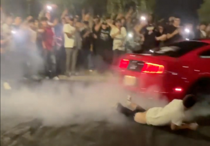 watch: mustang does donuts runs over spectator strips pants off