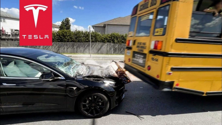 watch tesla model 3 get backed over and crushed by school bus