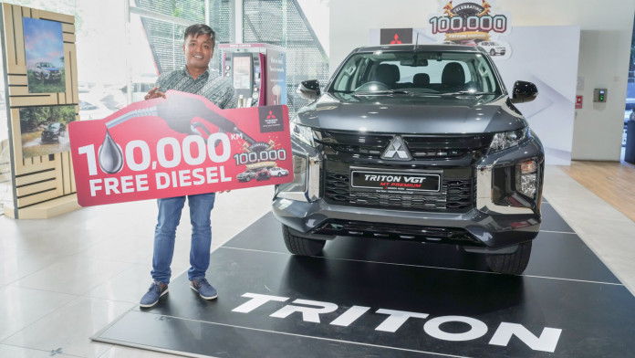 mitsubishi rewards 100,000th triton customer in malaysia with 100,000 km worth of diesel