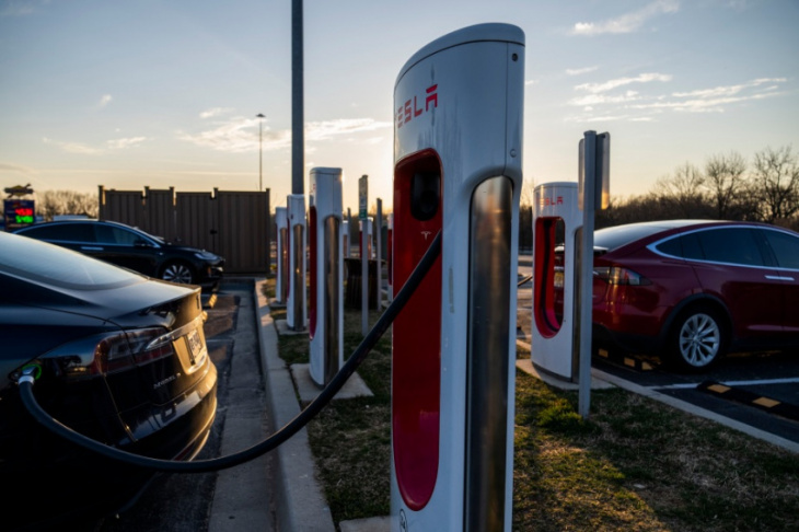 why do tesla owners tap the charger?