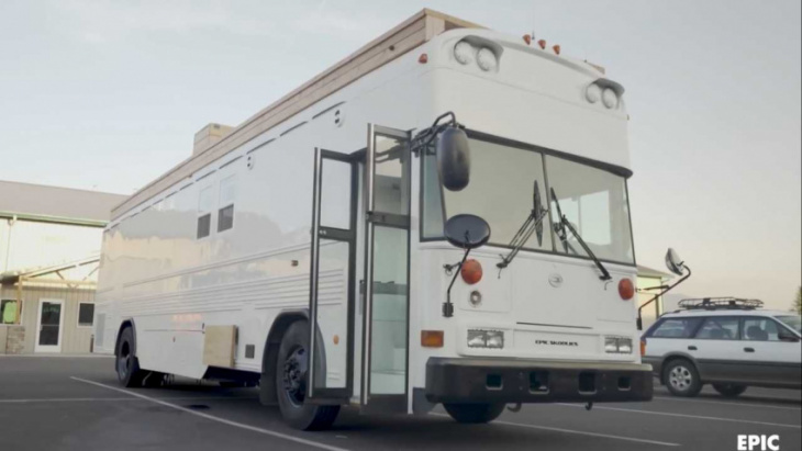 school bus becomes spacious luxury rv with two bedrooms, raised roof