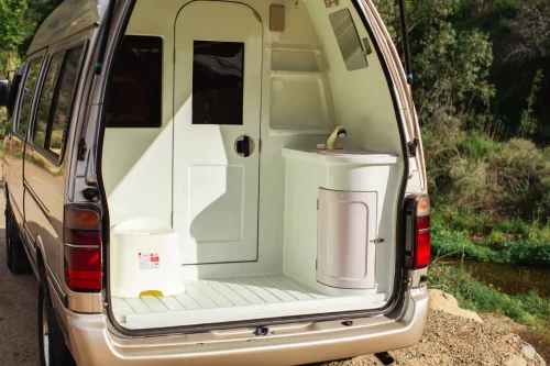 This $18K Toyota Van Hides A Private Bathroom With A Shower In The Back