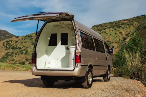 This $18K Toyota Van Hides A Private Bathroom With A Shower In The Back