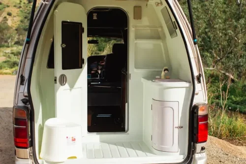 This $18K Toyota Van Hides A Private Bathroom With A Shower In The Back