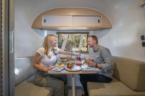 Airstream’s New Baby Camper Fits A Kitchen And A Bed For Two Into 17 Feet