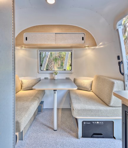 Airstream’s New Baby Camper Fits A Kitchen And A Bed For Two Into 17 Feet